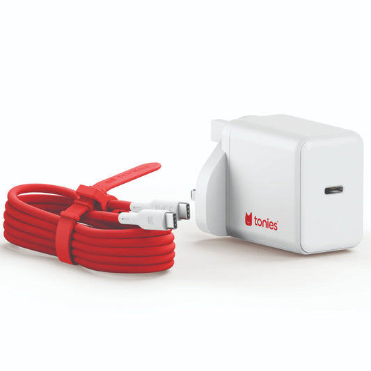 White electronic device with red cable on a white background