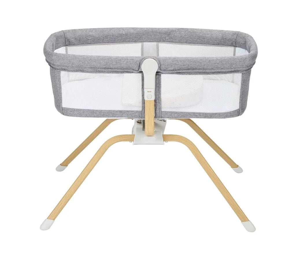 Gray and beige baby crib with mesh sides on a white background