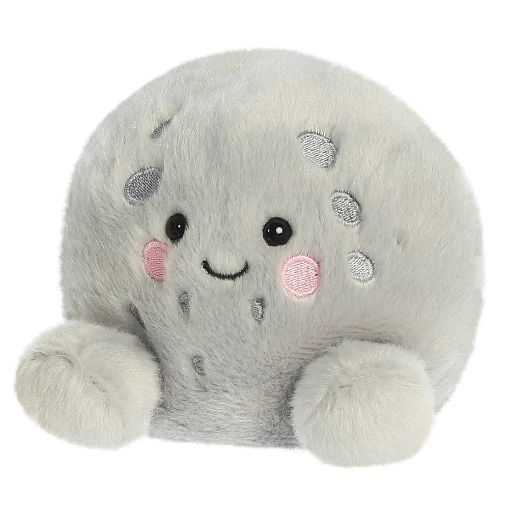 Plush toy resembling a gray seal with a smiling face on a white background