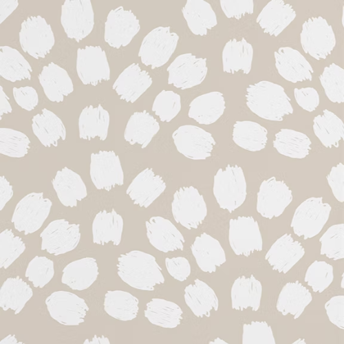 Pattern of white brush strokes on a beige background