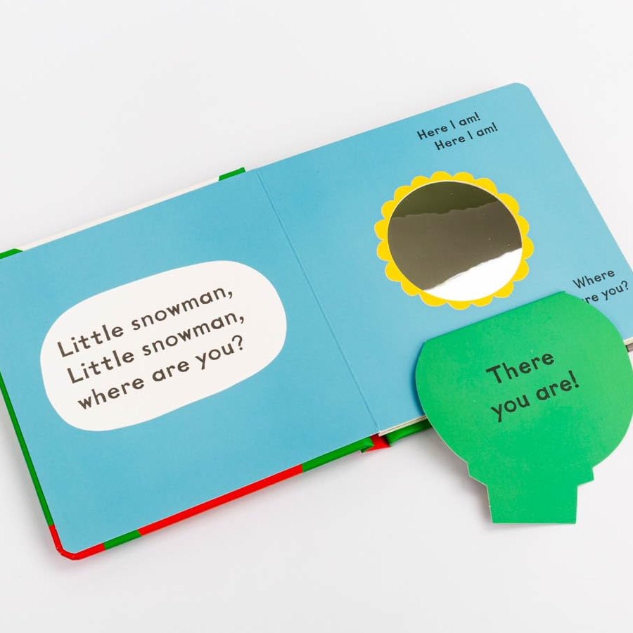 Children's book with a snowman-themed question and answer page on a white background