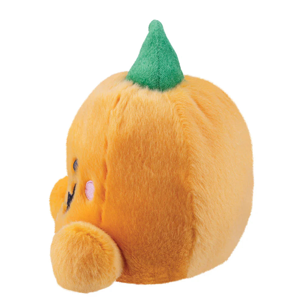 Plush toy shaped like a pumpkin with a green stem on a white background