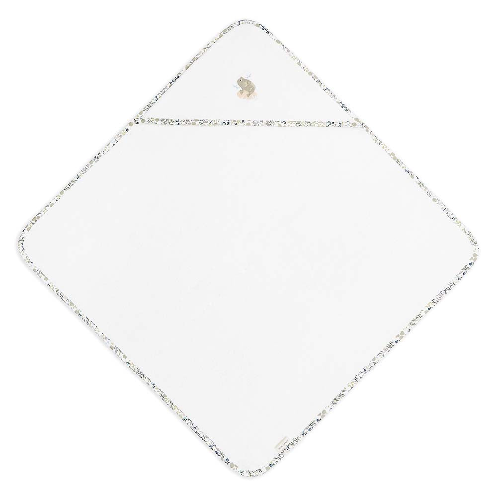 White square towel with a gold border on a white background