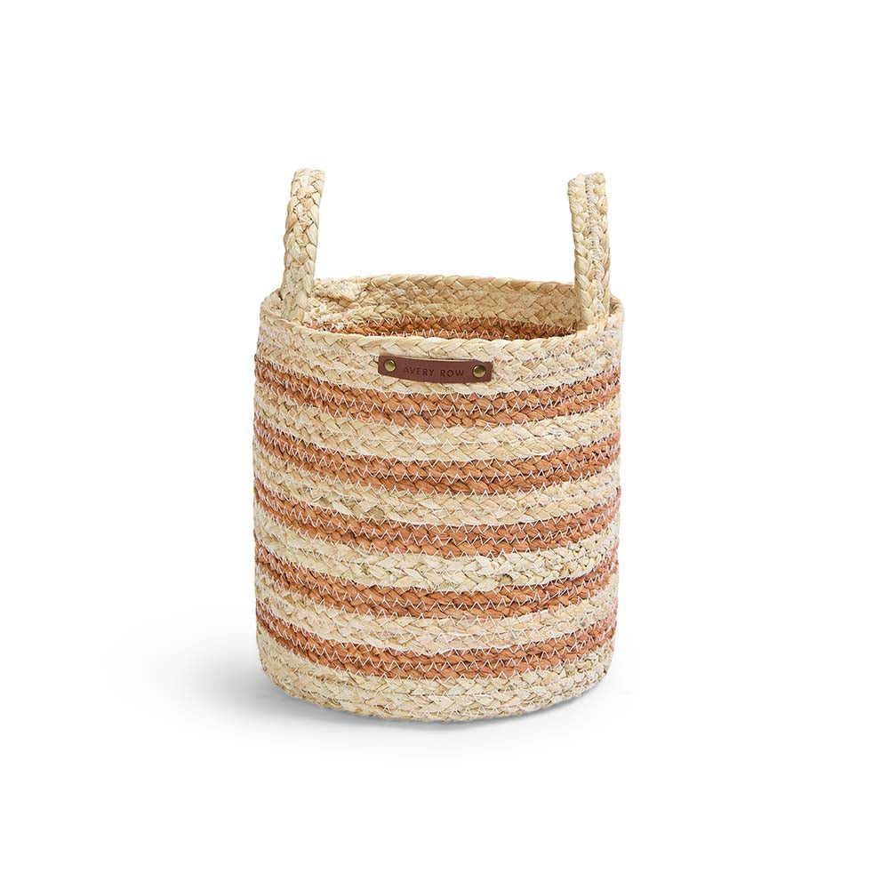 Woven basket with striped pattern and handles on a white background
