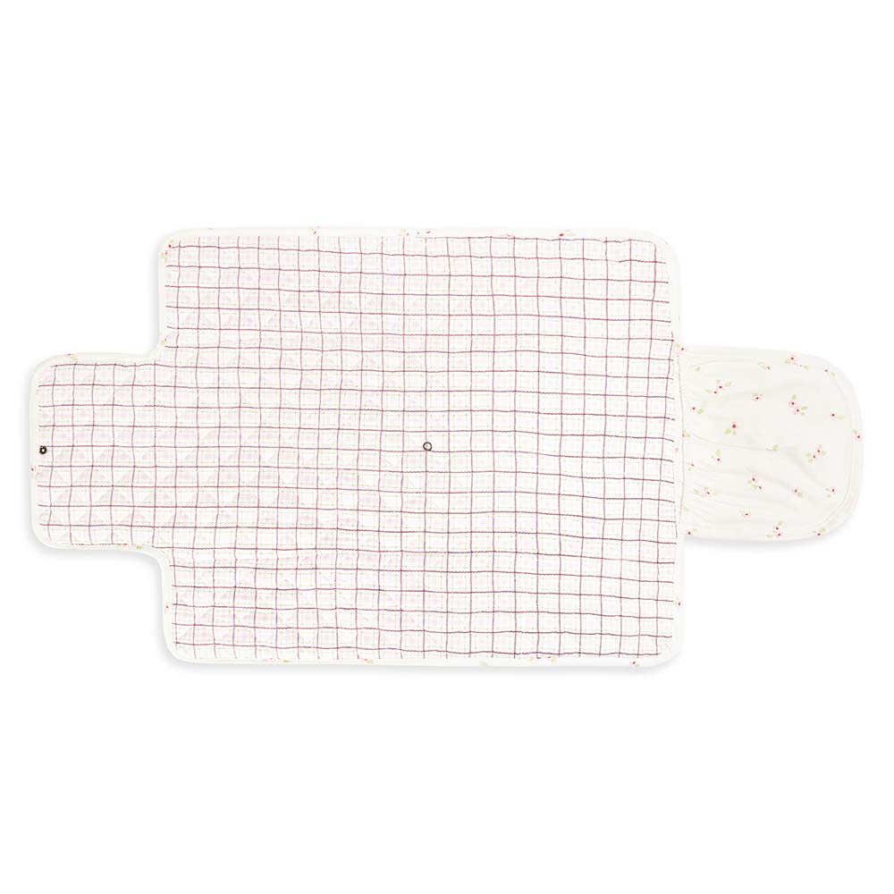 Grid-patterned bath mat with a white border on a white background