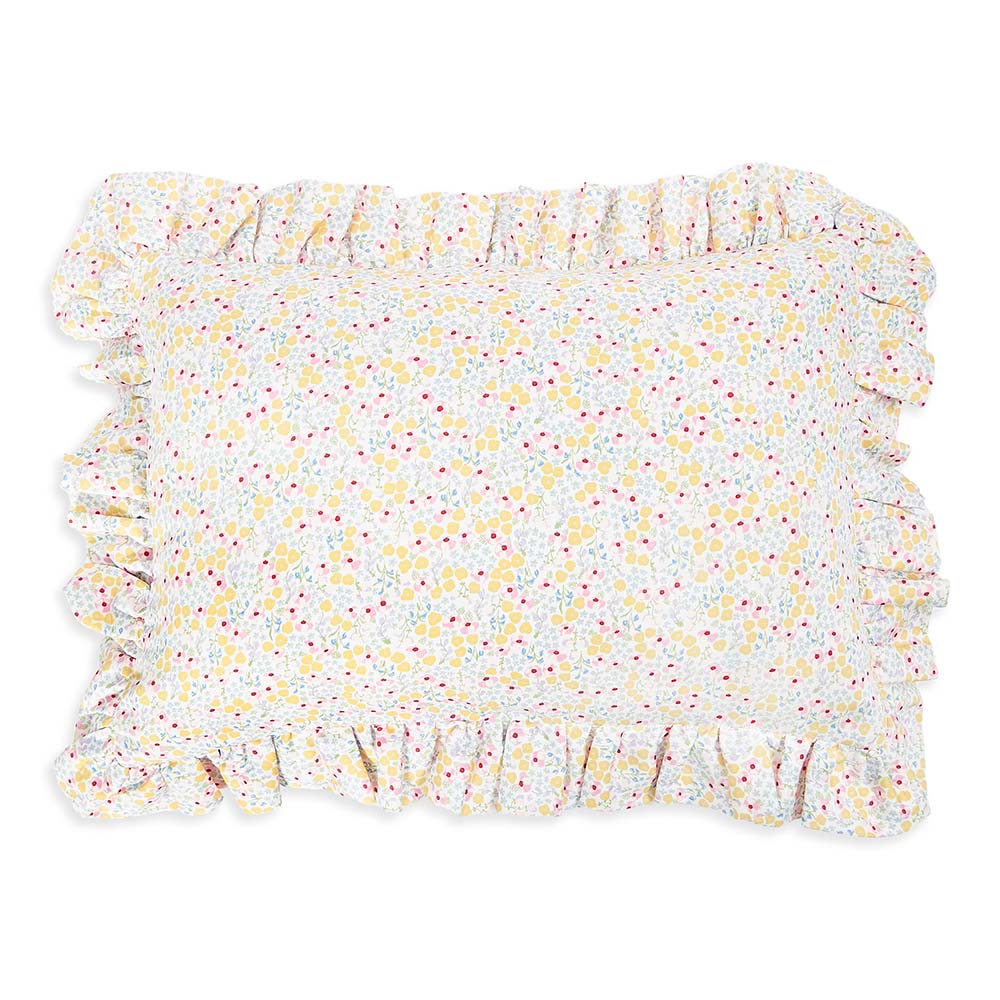 Floral patterned rug with ruffled edges on a white background