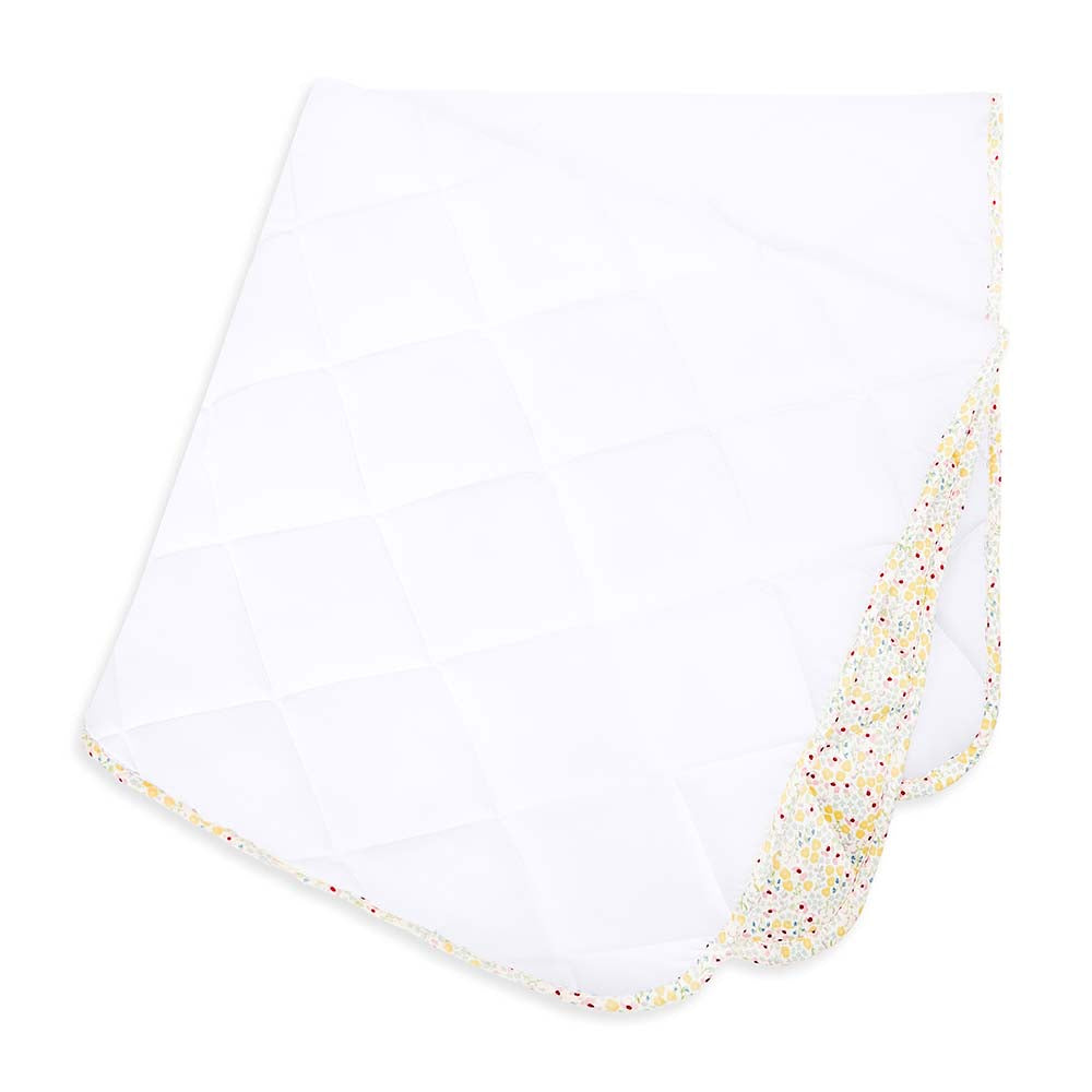 White baby blanket with colorful speckled border on a white background