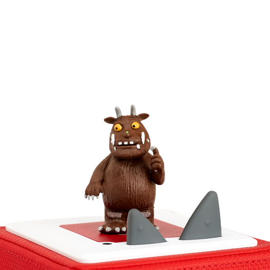 Brown monster figurine on a white background