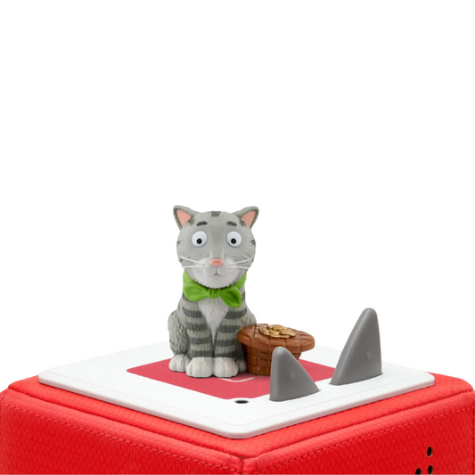 Cat figurine with a green scarf on a red base with shark fins