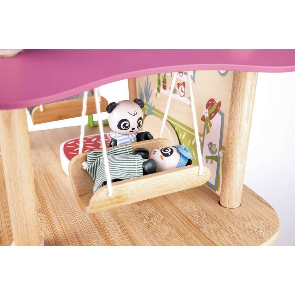 Wooden toy with panda characters on a swing, set against a pink and wooden background.