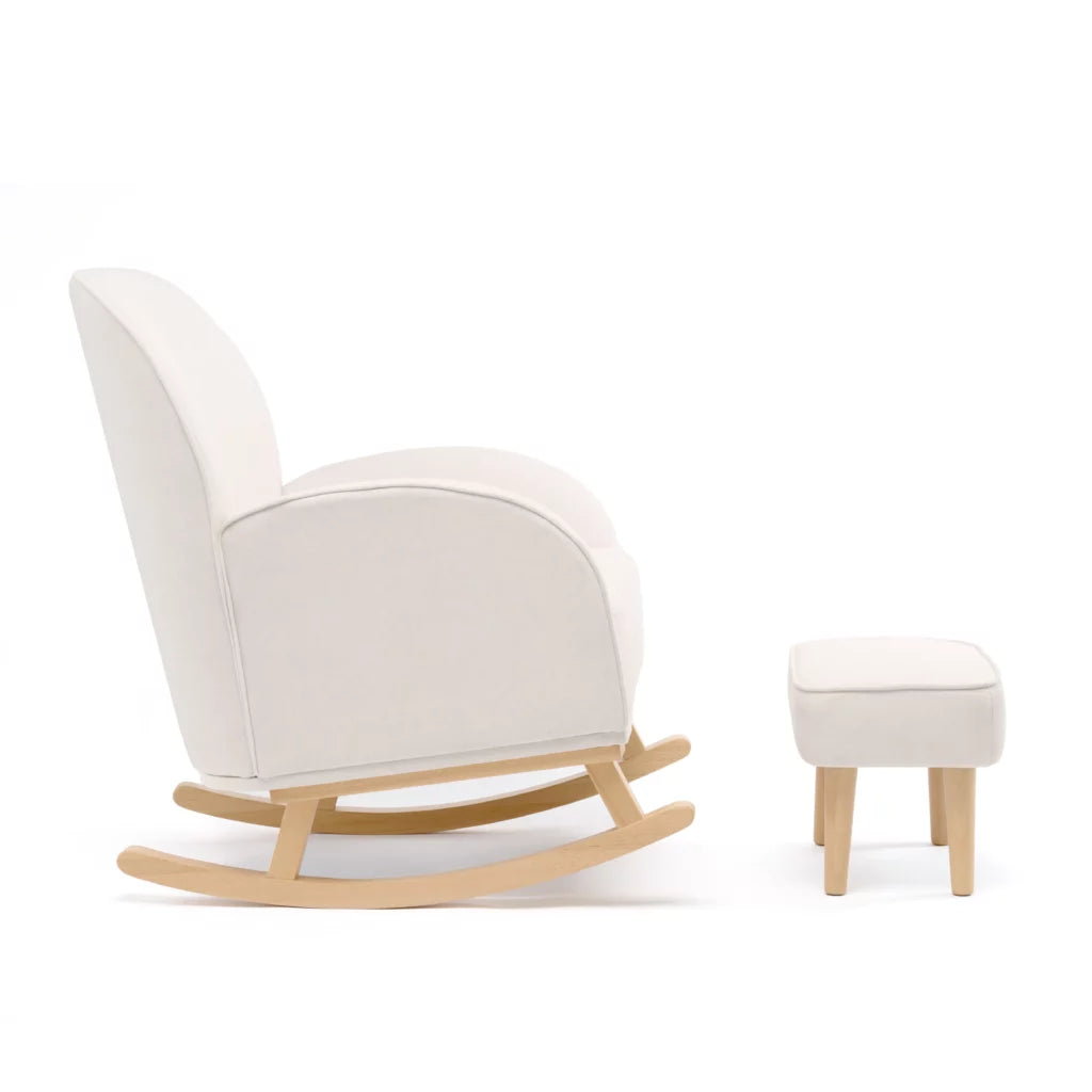 White rocking chair with wooden legs and matching ottoman on a white background