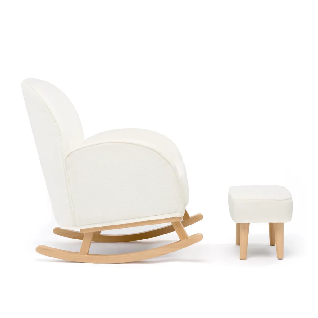 White rocking chair with wooden legs and matching ottoman on a white background