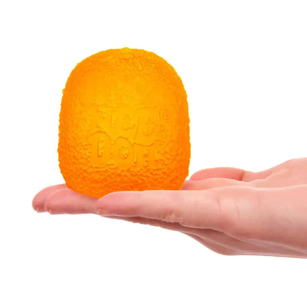 Orange textured ball held in a hand against a white background