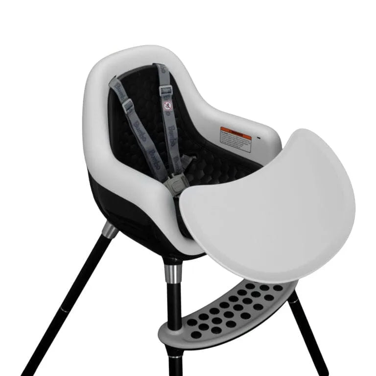 Baby high chair with black and white design on a white background