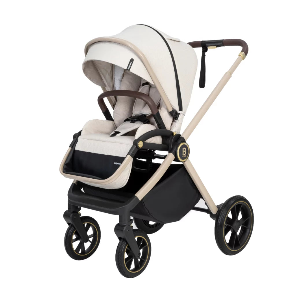 White and beige baby stroller with black wheels on a white background