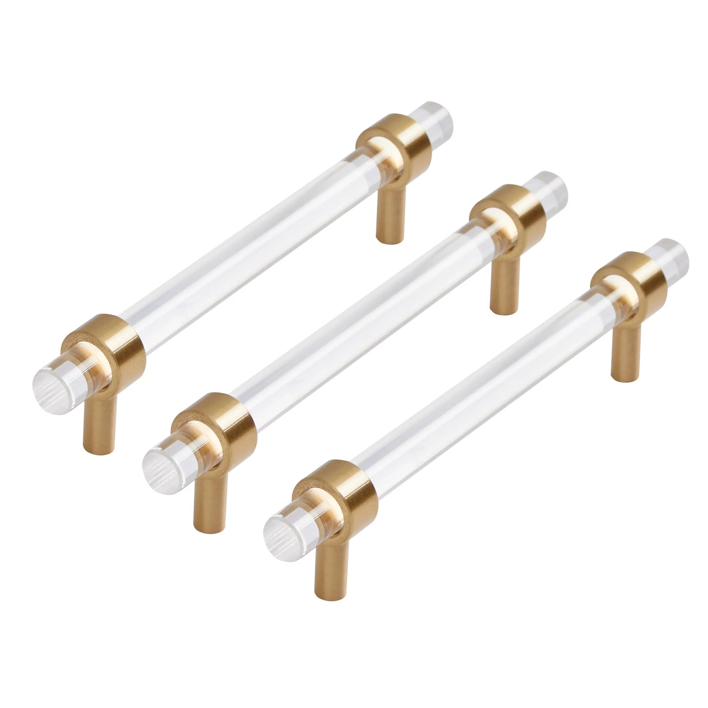 Set of three gold and clear acrylic cabinet handles on a white background