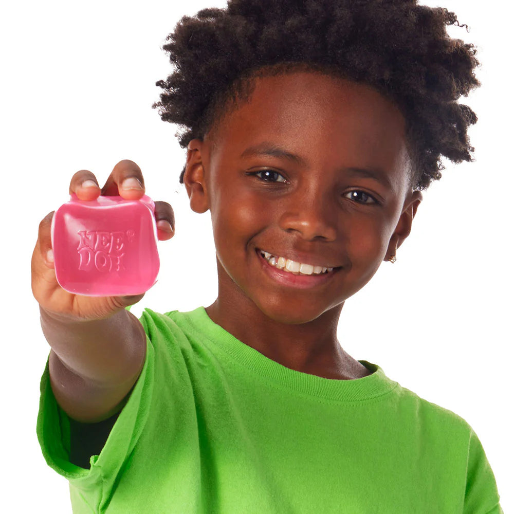 Child holding a pink product with a white background