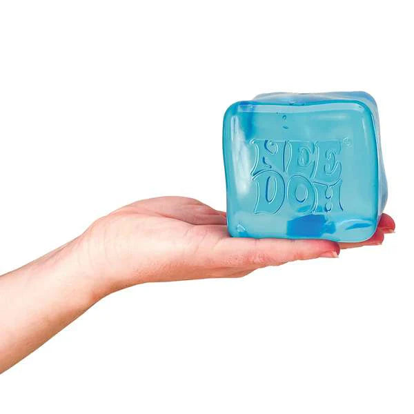 Blue cube-shaped product with 'Fie Doh' branding held in a hand against a white background