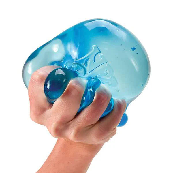 Hand holding a blue stress ball against a white background
