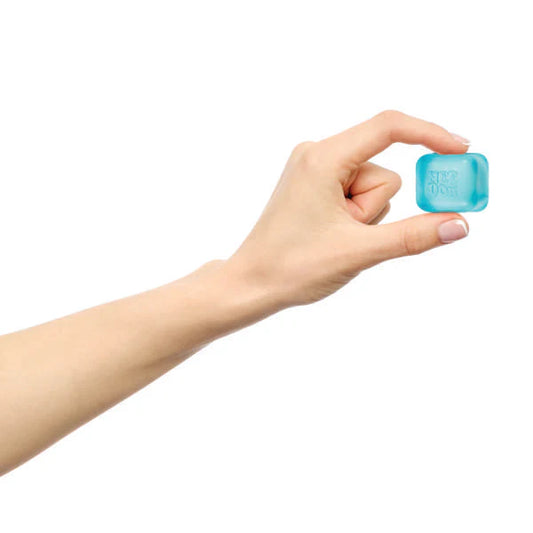 Hand holding a blue rectangular object against a white background