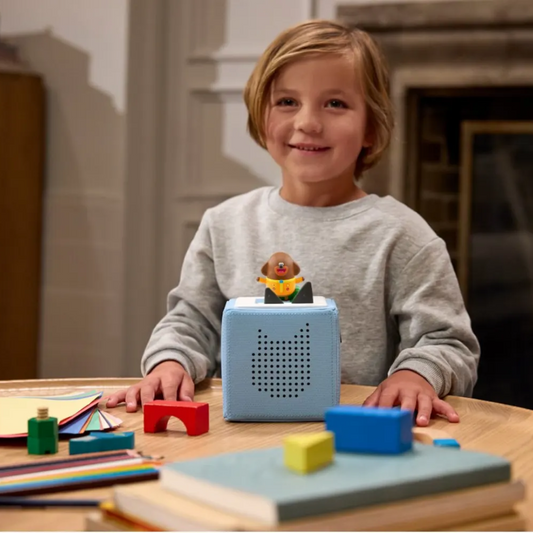 Child playing with educational toys on a table