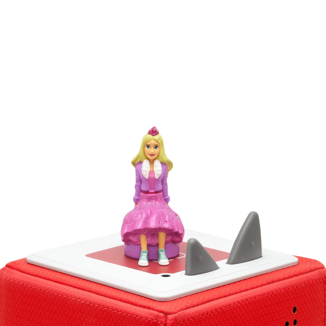 Toy figure on a red toy boat with shark fins on a white background
