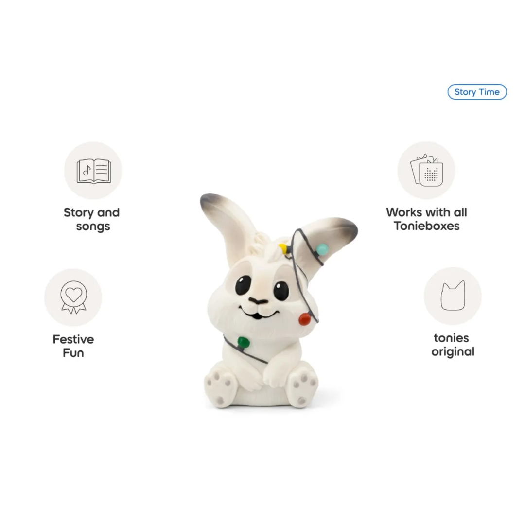White rabbit-shaped toy with festive lights on a white background, featuring icons and text about Tonie products.