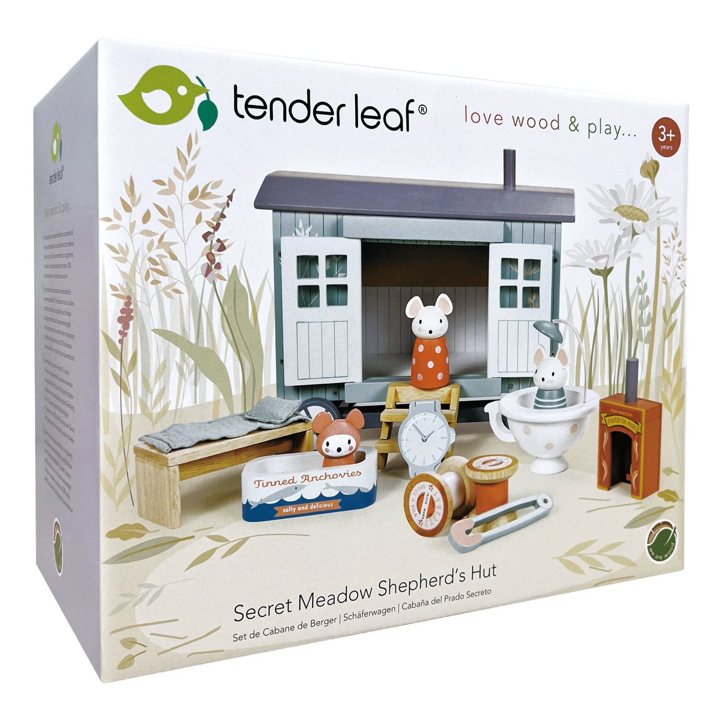 Tender Leaf toy set packaging for 'Secret Meadow Shepherd's Hut' with toys and hut on a white background.