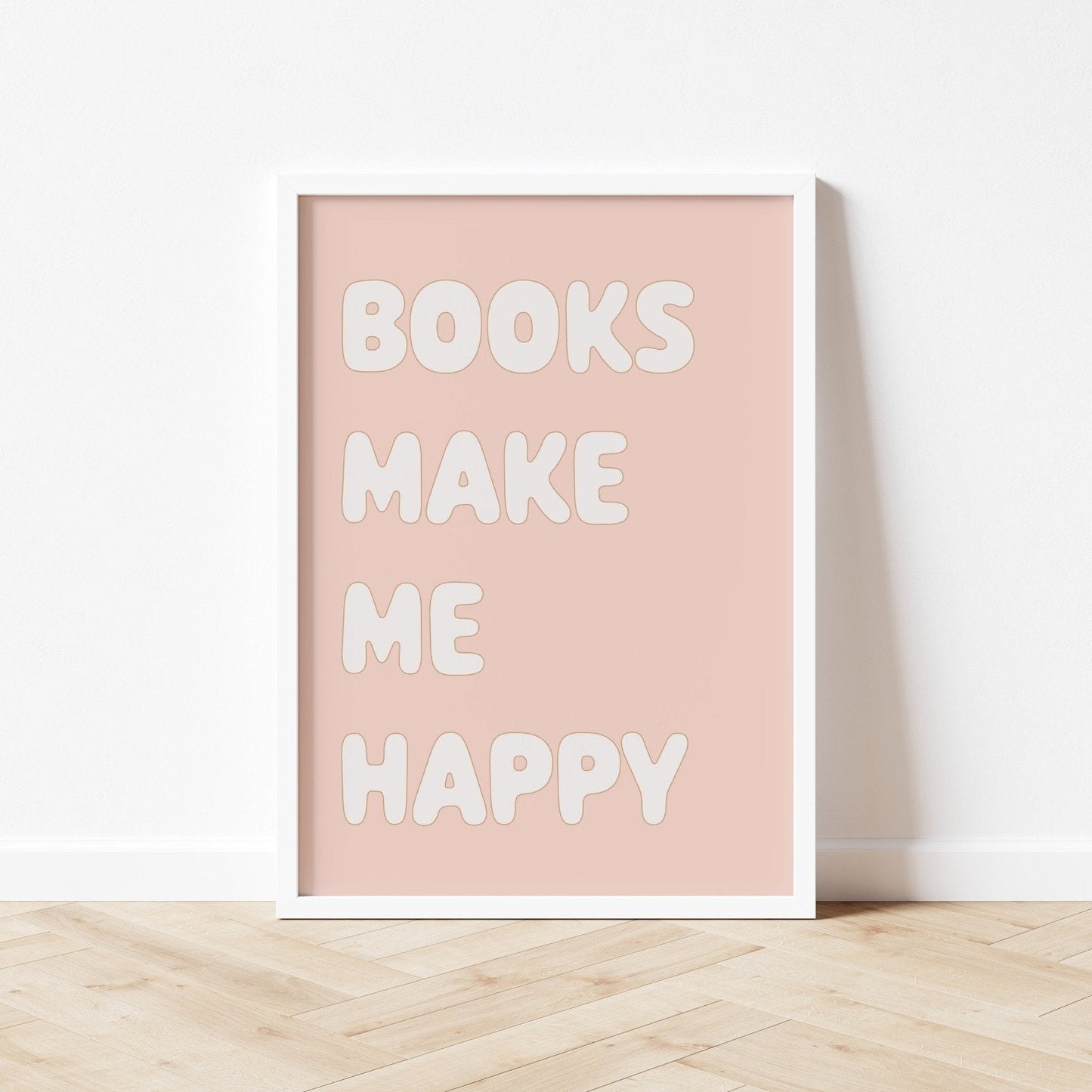 Poster with 'Books Make Me Happy' text on a light pink background