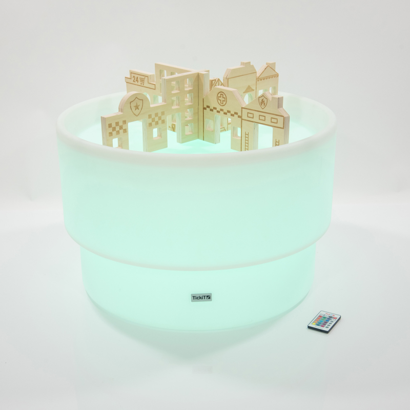 Sensory mood table with wooden dividers in the style of buildings. Glowing Green