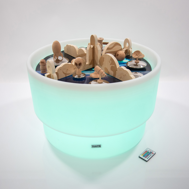 Round light table with wooden dividers in a space and planet print. with e space play mat and small world set up