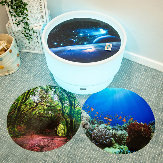 Sensory play discovery table with 3 different play mats.