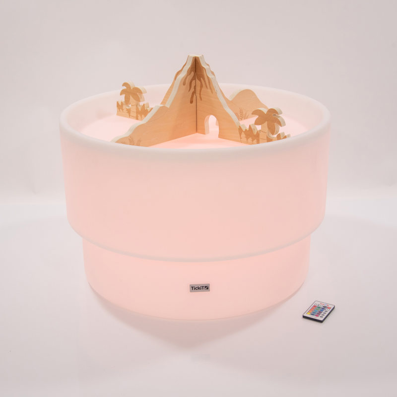 Round light up sensory table with a wooden volcano