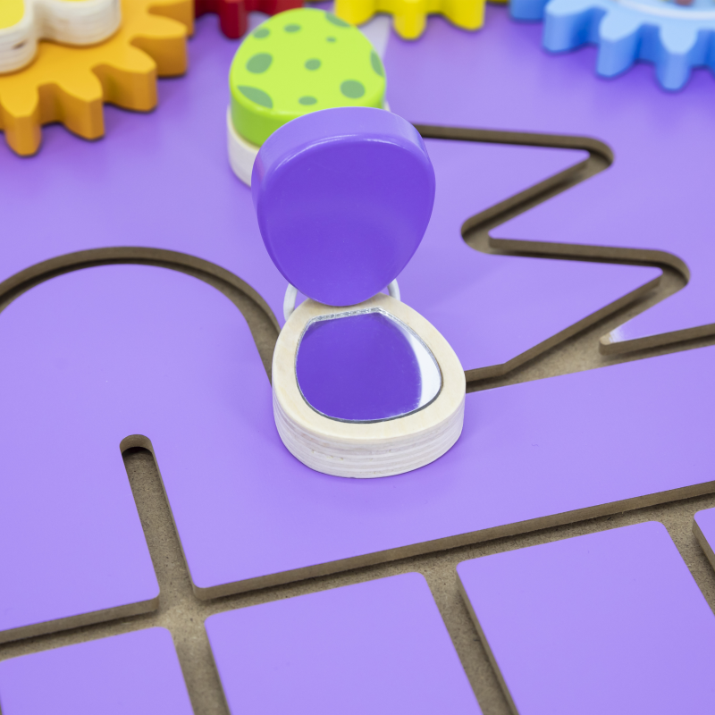 Purple hourglass-shaped object on a purple grid with colorful surrounding objects