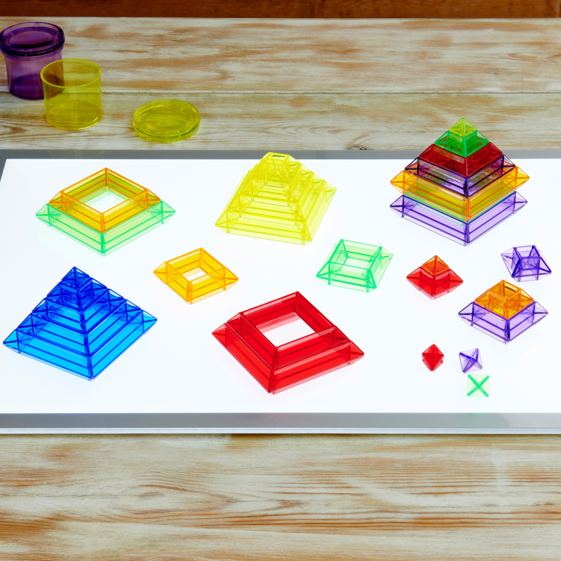 Colourful plastic blocks on a light panel