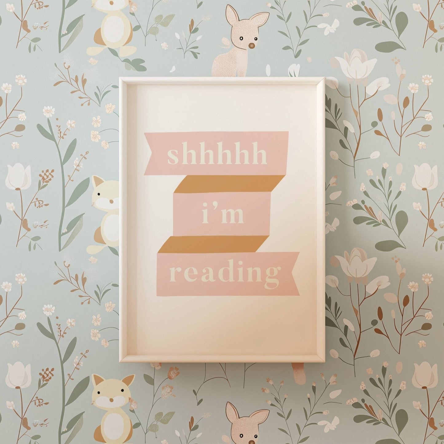 Framed picture with 'shhhh i'm reading' text on a floral and animal wallpaper background