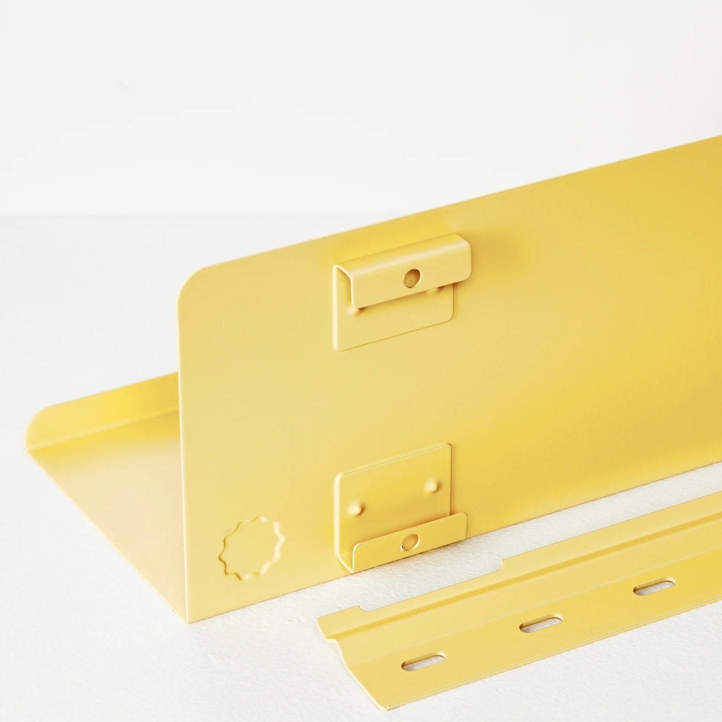 Yellow metal bracket on a white background