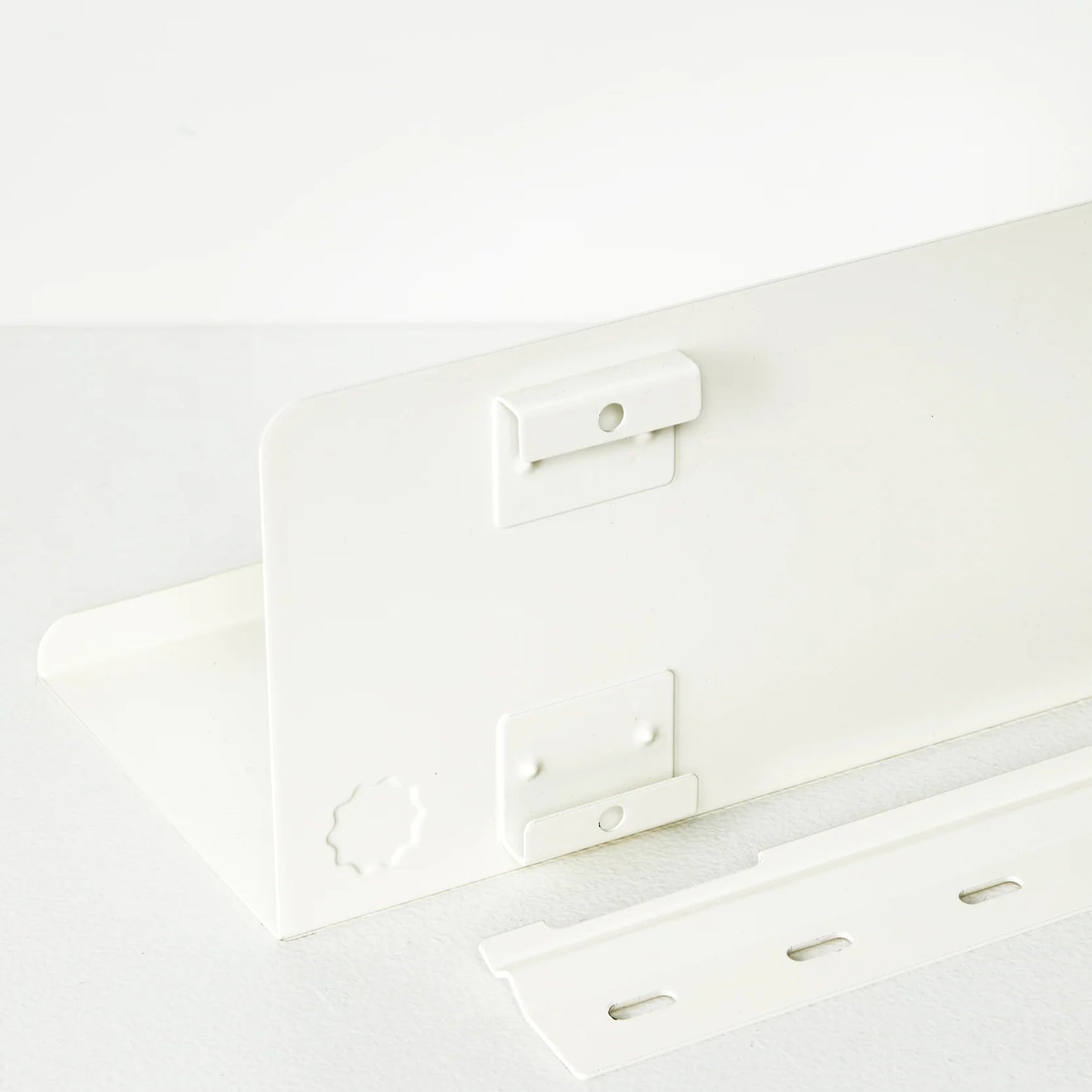White metal bracket on a white background