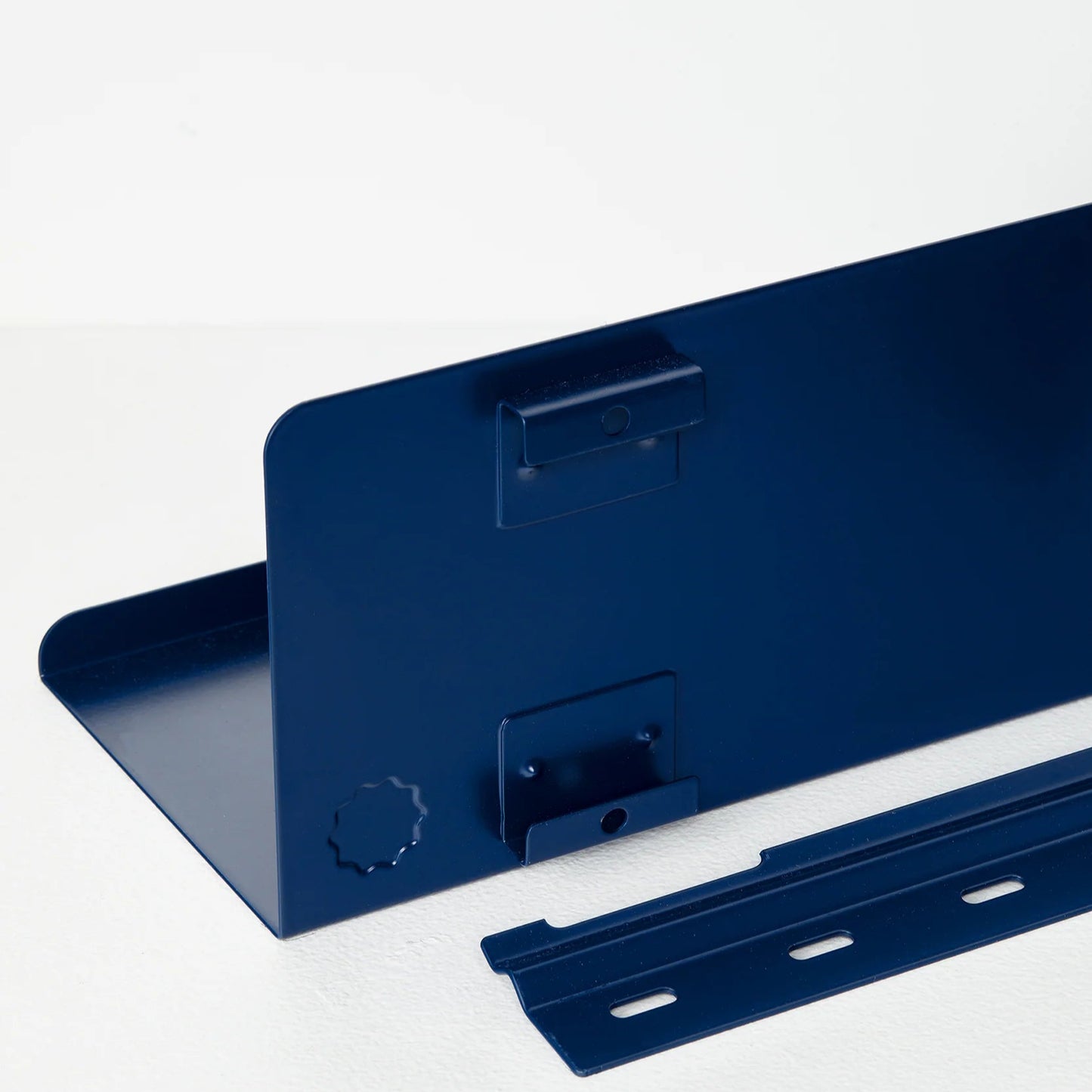 Blue metal shelf bracket on a white background