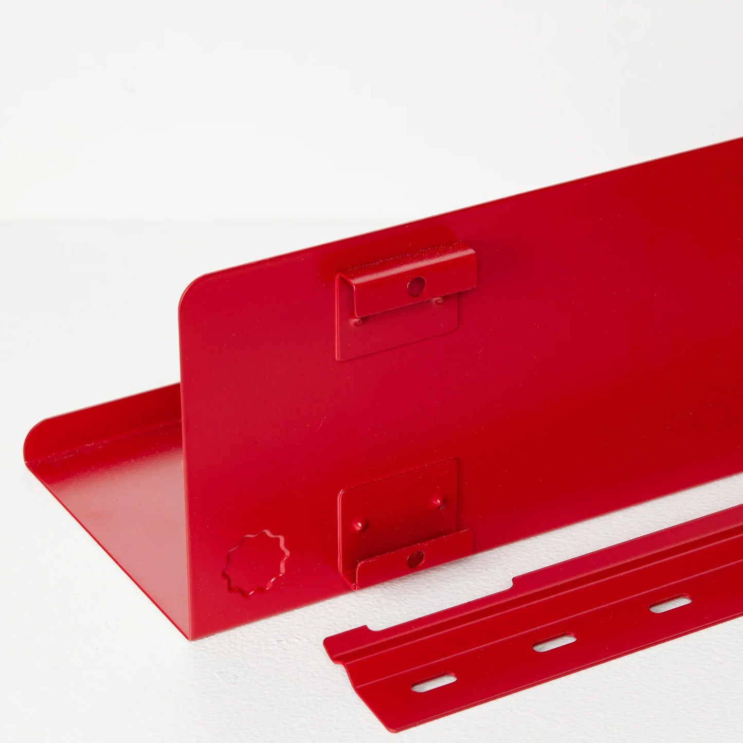 Red metal bracket on a white background