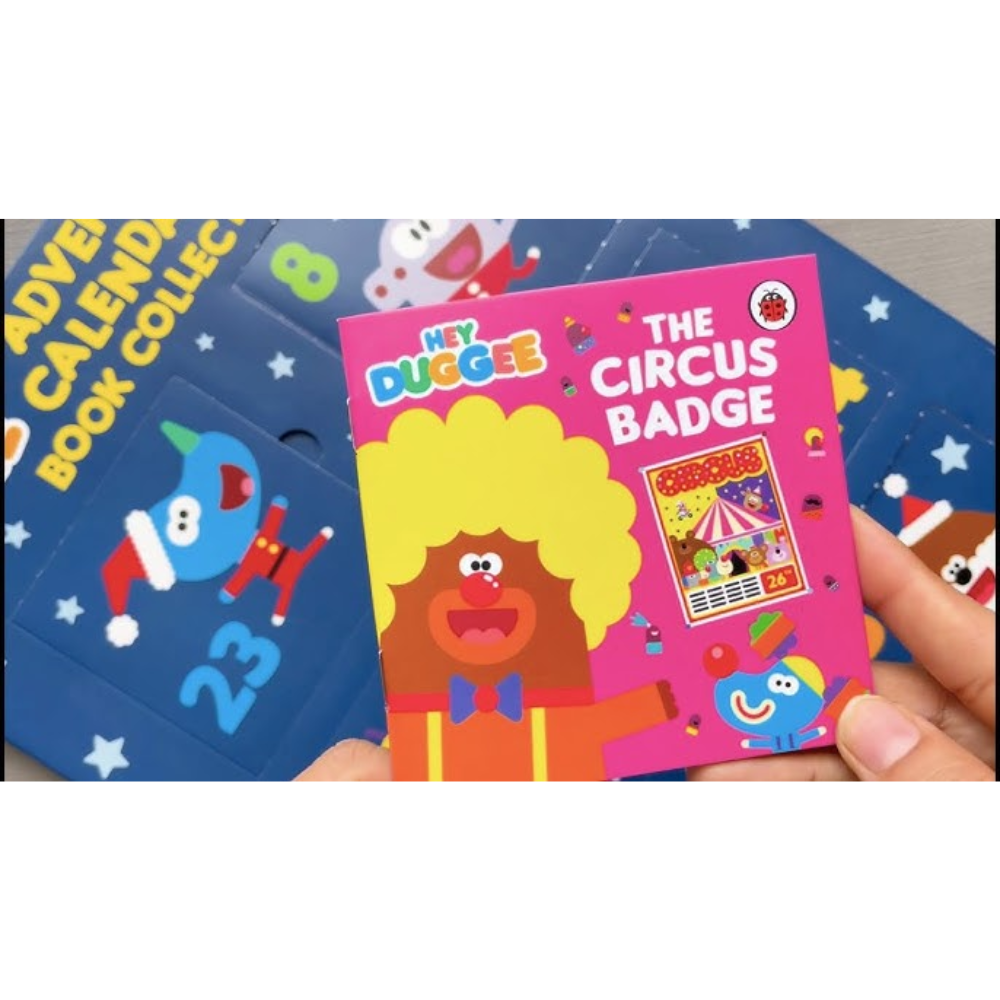 Children's book titled 'The Circus Badge' held by a hand with a colorful background