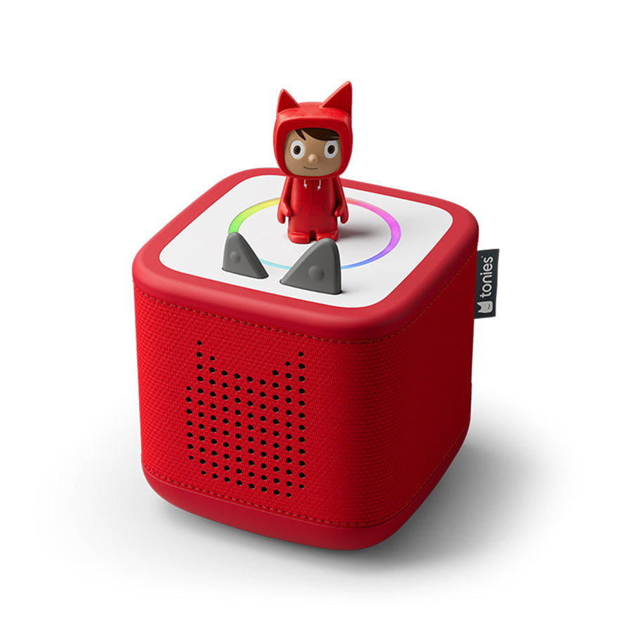 Red toy device with a small figure on top on a white background