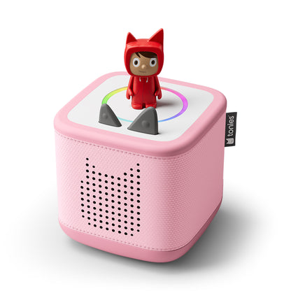 Pink toy speaker with a small figure on top on a white background