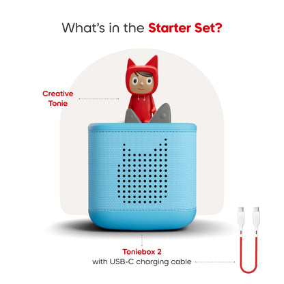 Toniebox 2 with USB-C charging cable and a red hooded figure on a white background