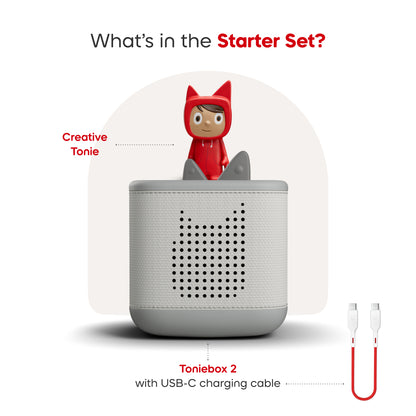 Toniebox 2 with USB-C charging cable and a red figurine on a white background