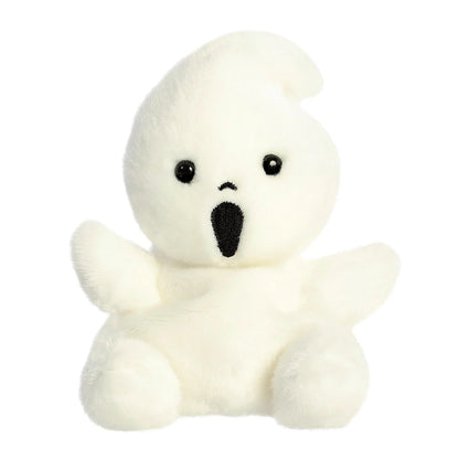 Small white plush toy with a black face on a white background
