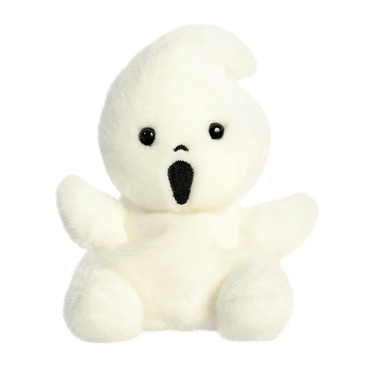 Small white plush toy with a black face on a white background