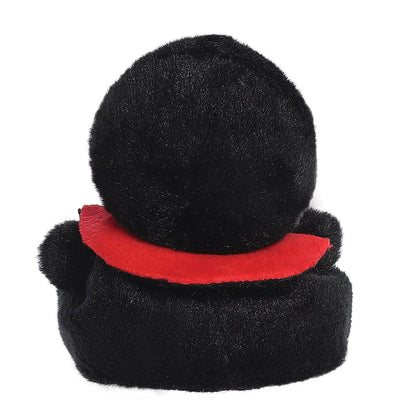 Black plush toy with a red collar on a white background