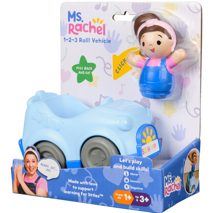 Ms. Rachel 1-2-3 Roll! Vehicle toy in its original retail packaging, featuring a light blue plastic vehicle and a plastic doll figure of Ms.