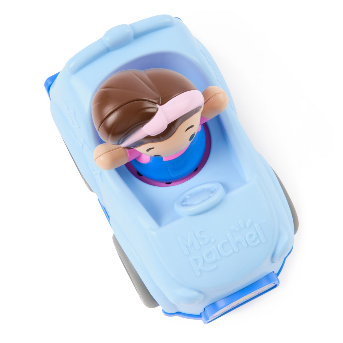 Toy figure of a character with brown hair in a blue plastic vehicle on a white background
